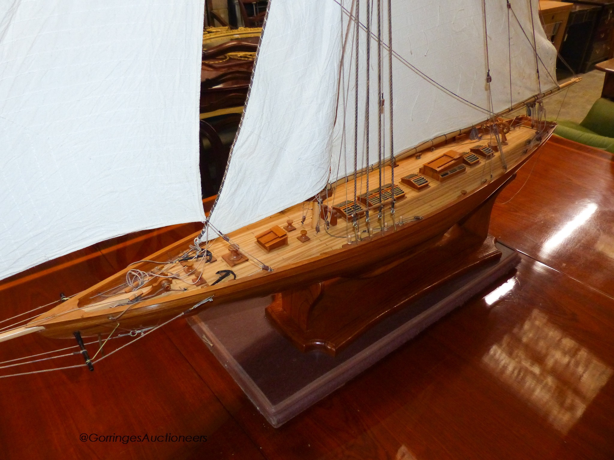 A large single masted model yacht on stand. H-160cm